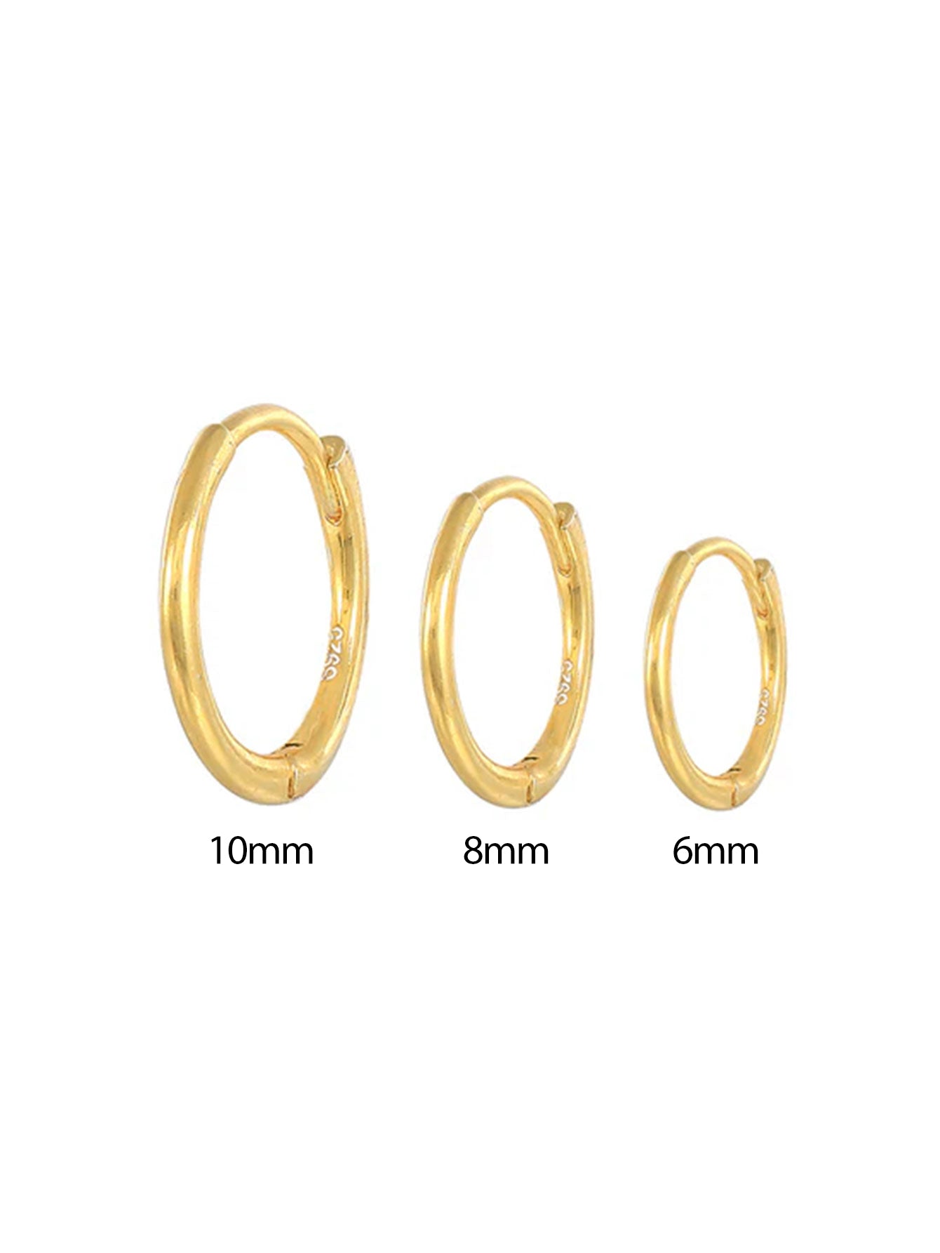 Emilia – Örhängen av tunt guld med mjuk glans.